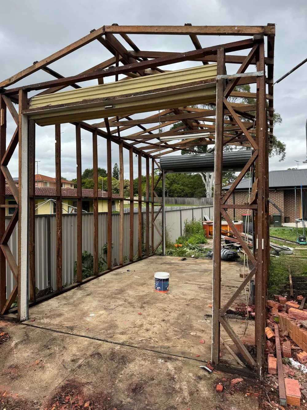 Garage frame and concrete slab remaining after AJ removed roof and wall sheeting