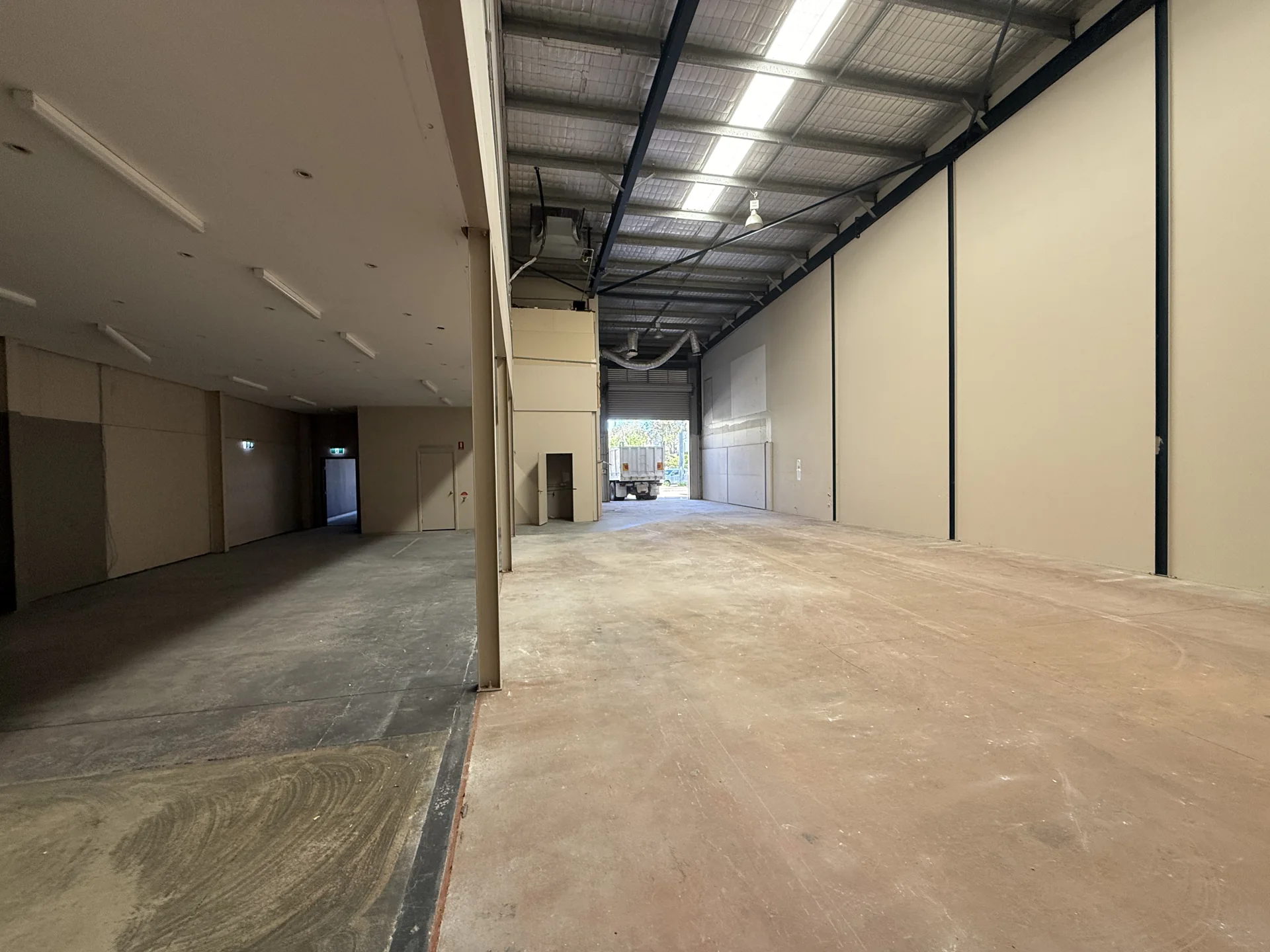 Cleared commercial interior following AJ office and mezzanine strip-out