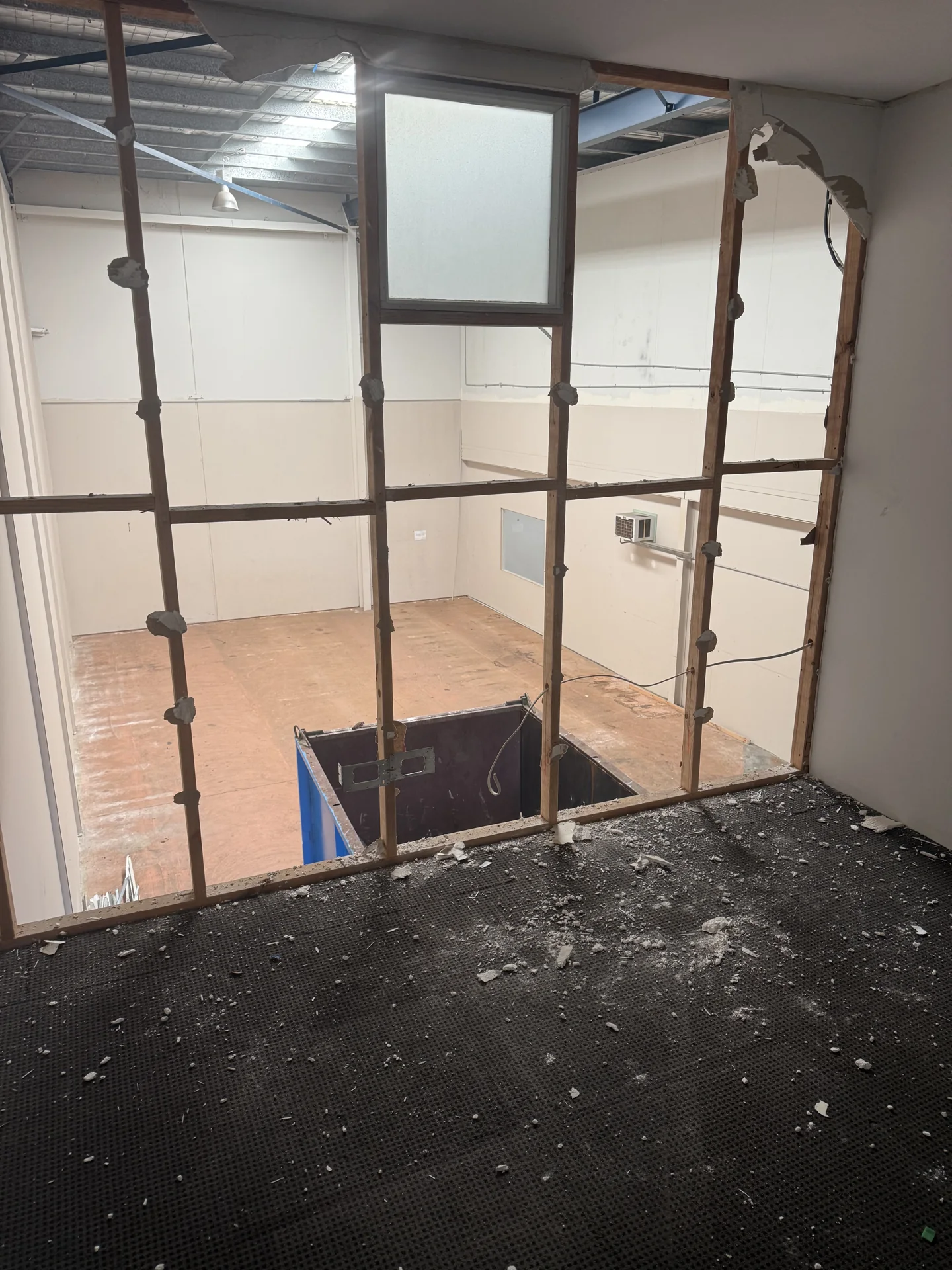 Upstairs office partition framing exposed during removal